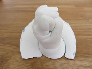 A first baby hand made of porcelain plaster
